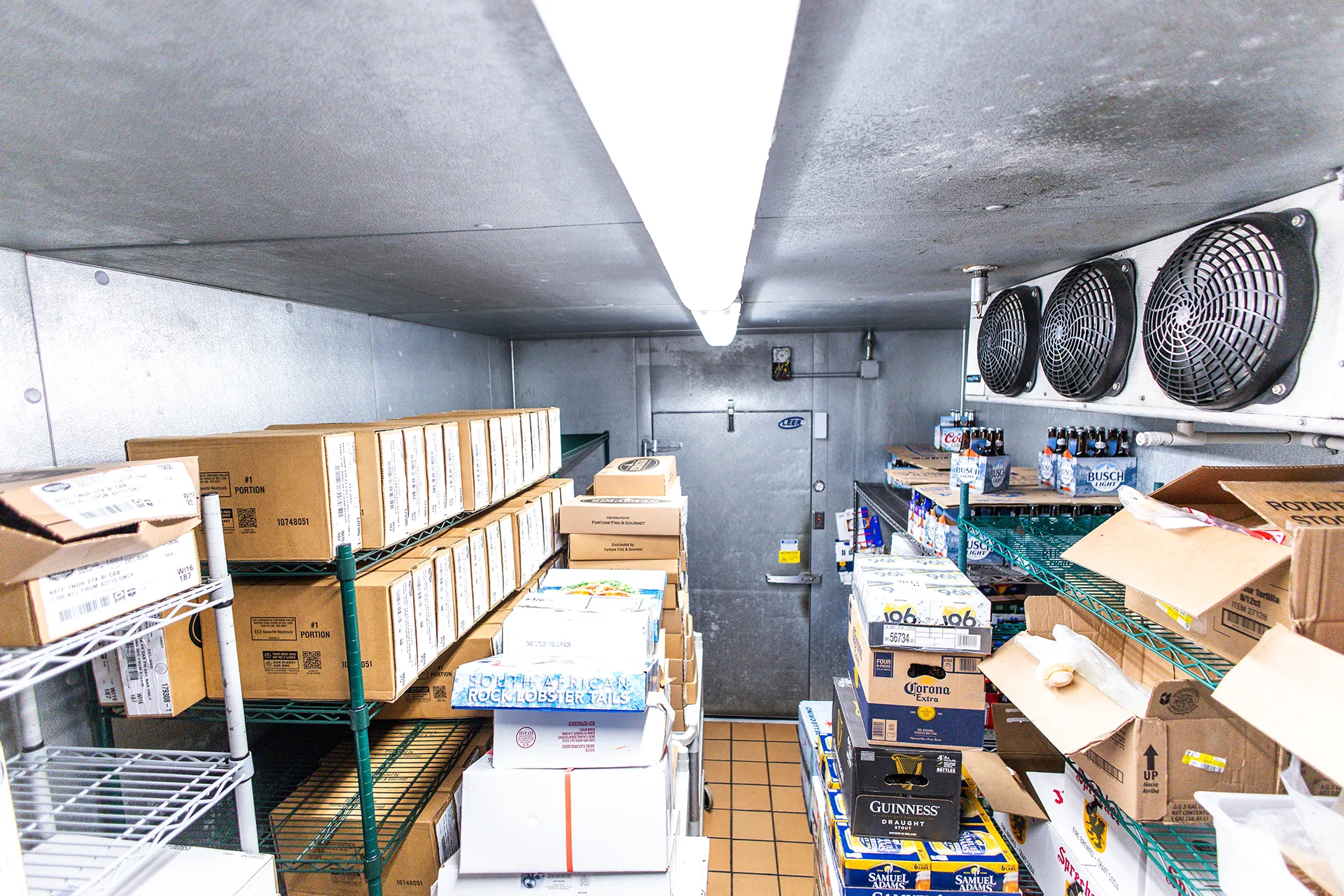del_bar_project13 Walk-in cooler with stocked food and beverage inventory