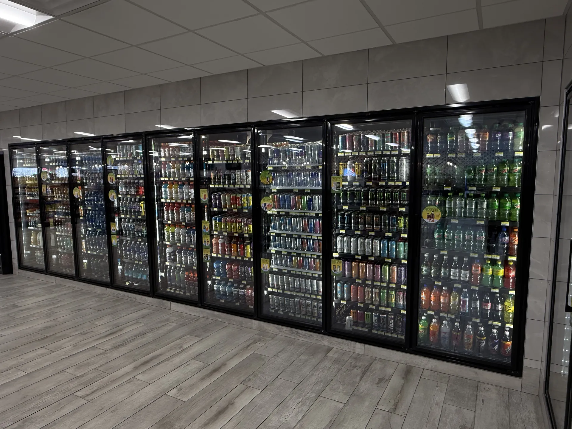 mart_project5 Glass door beverage coolers stocked with soft drinks and energy drinks